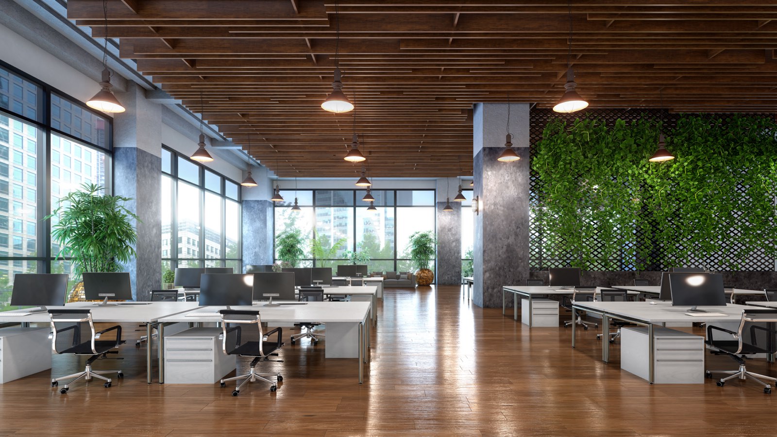 Bright open-plan office with a green living wall after a commercial cleaning